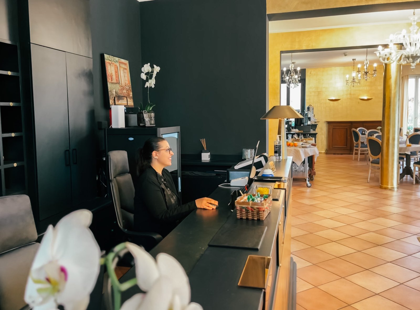 The reception desk, the breakfast room through the doorway.